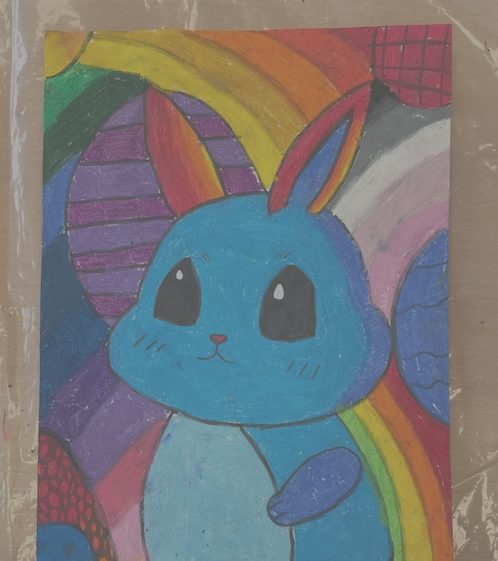 Blue bunny with rainbow