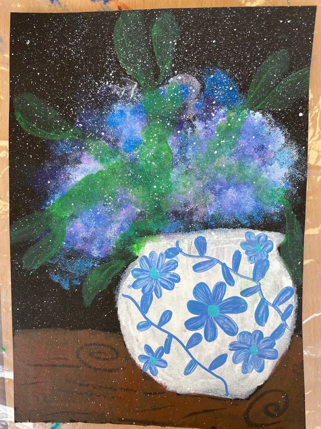 Blue and white vase with flowers